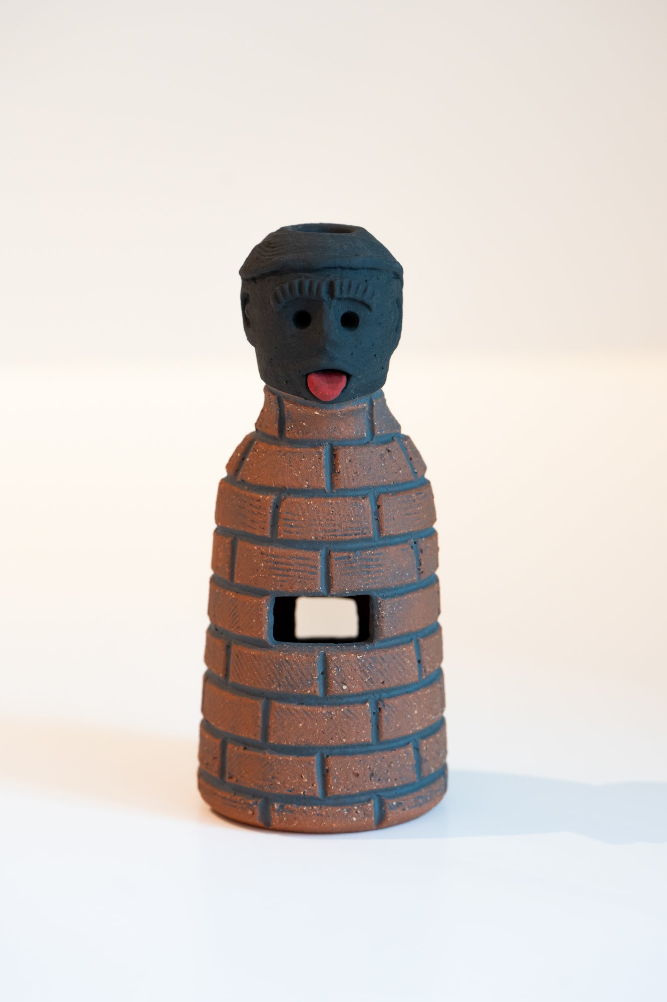 John Roy Bottle Man Bricks with Tongue Out